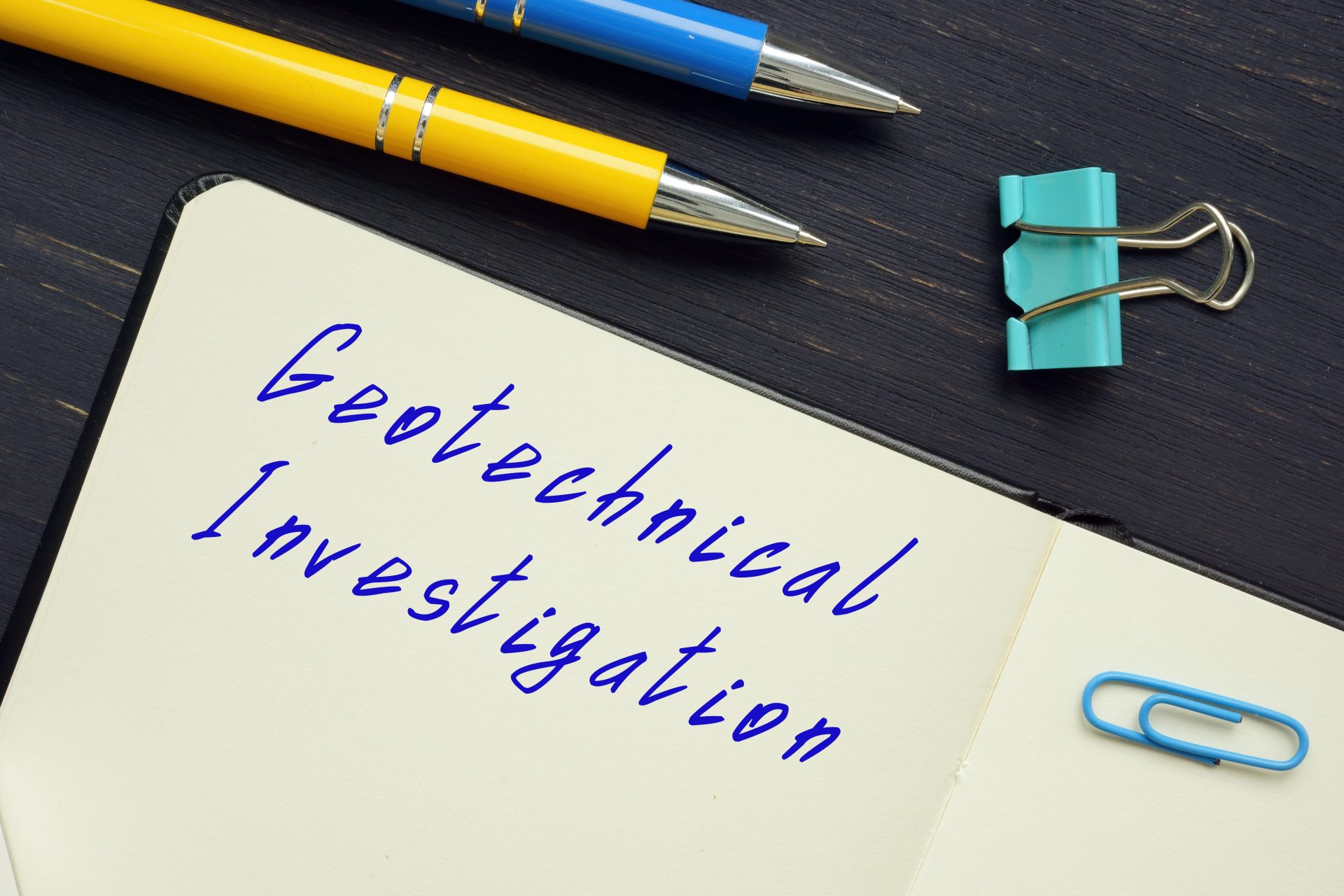 Geotechnical investigation notebook and pens